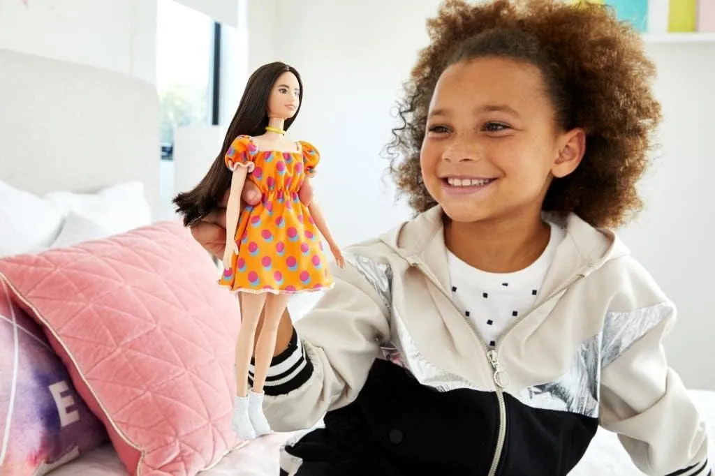 Barbie Fashionistas Doll #160 with Long Brunette Hair Wearing Patterned Orange Dress, White Shoes & Yellow Choker, Toy for Kids 3 to 8 Years Old