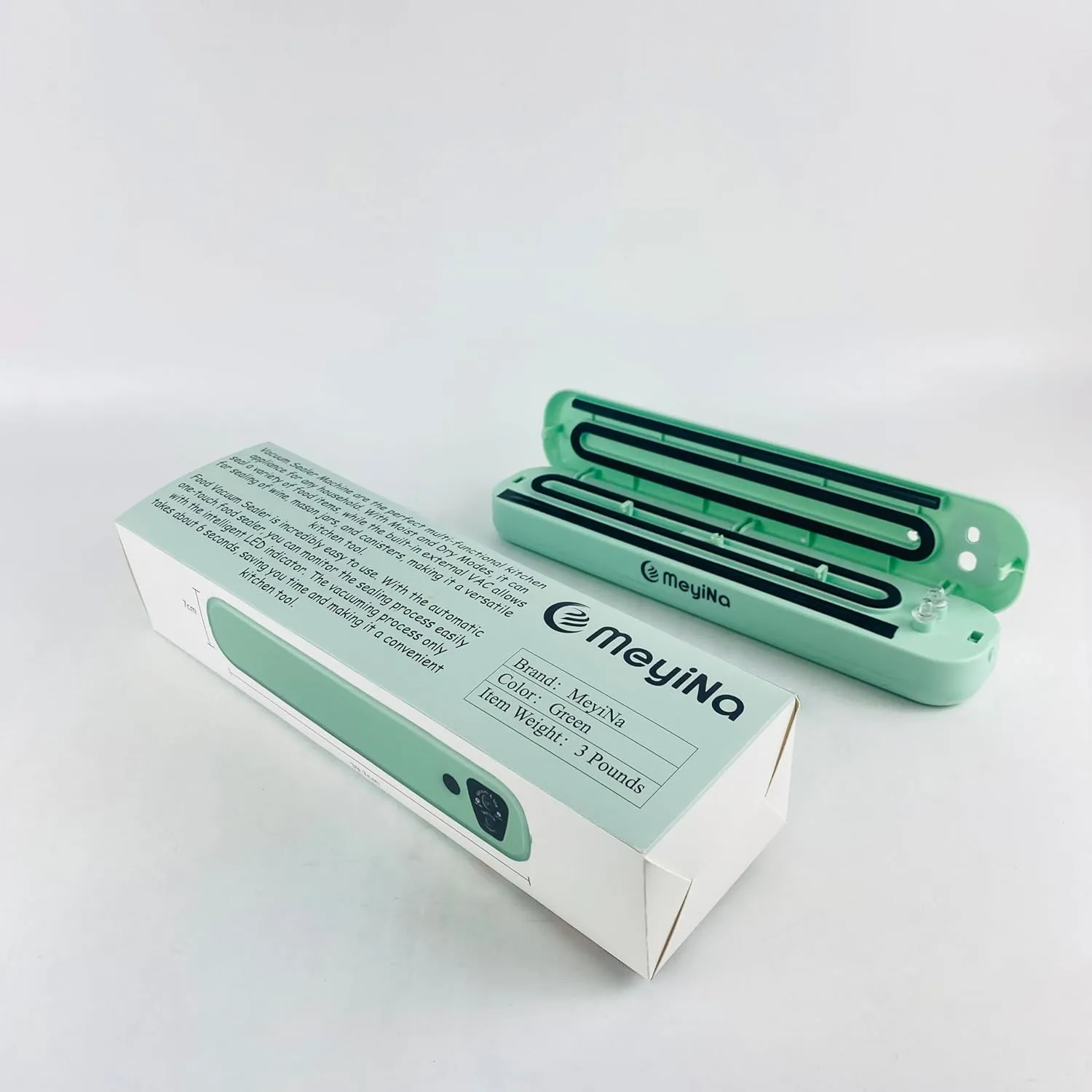 fully automatic vacuum sealing machine is small in size, easy to carry, and used for storing food and ingredients. Vacuum sealing machine - green